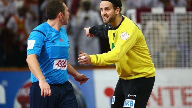 DOHA, QATAR - JANUARY 28:  Silvio Heinevetter of Germany (R) speaks to referee Slave Nikolov of Macedonia during the quarter final match between Qatar and Germany at Lusail Multipurpose Hall on January 28, 2015 in Doha, Qatar.  (Photo by Christof Koepsel/Bongarts/Getty Images)