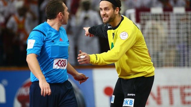 DOHA, QATAR - JANUARY 28:  Silvio Heinevetter of Germany (R) speaks to referee Slave Nikolov of Macedonia during the quarter final match between Qatar and Germany at Lusail Multipurpose Hall on January 28, 2015 in Doha, Qatar.  (Photo by Christof Koepsel/Bongarts/Getty Images)